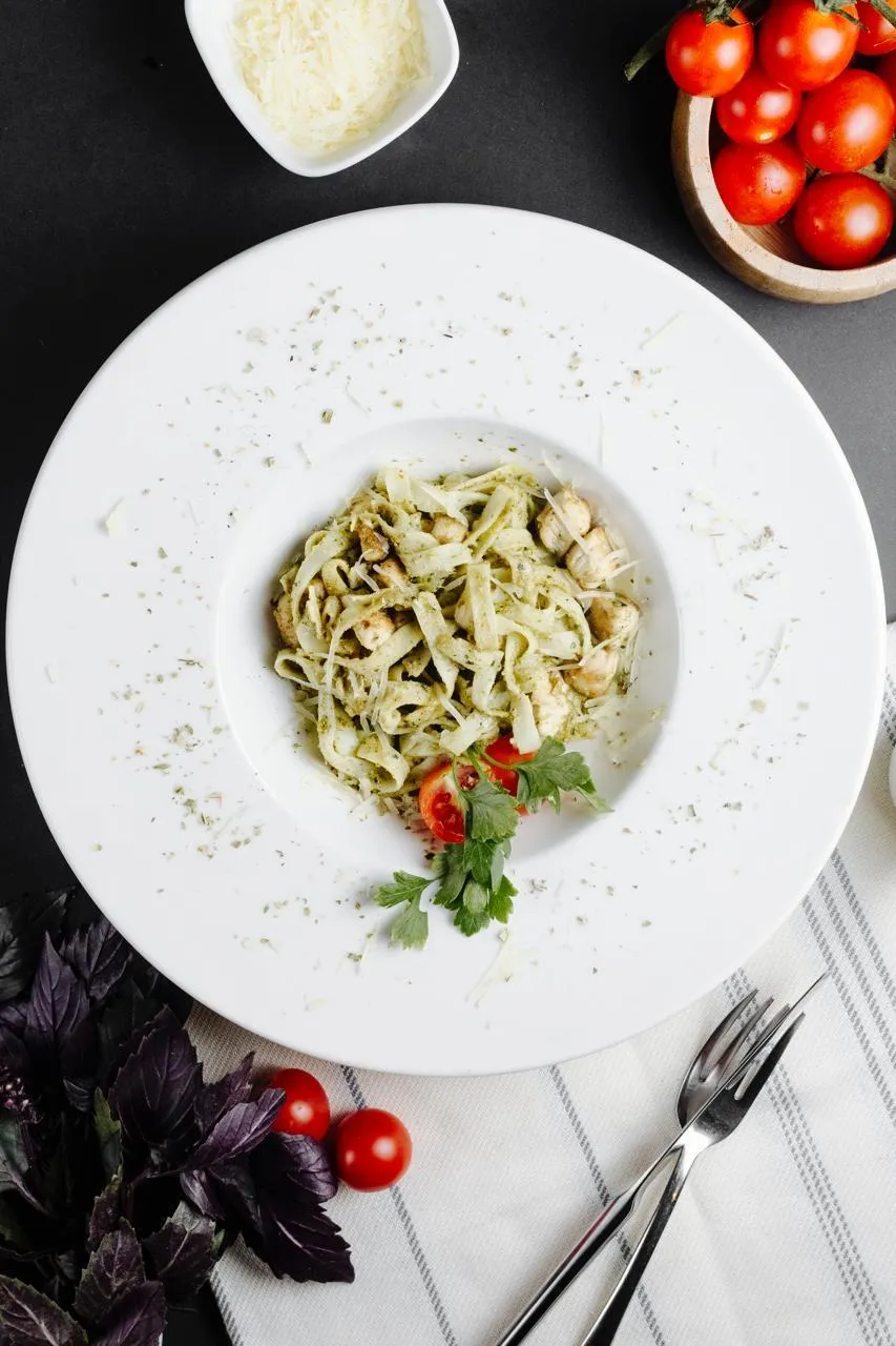 Tagliatelle with pesto, grilled chicken, parmesan and cherry tomatoes